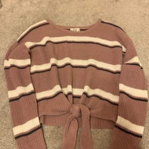 pink, cropped sweater with white and black stripes